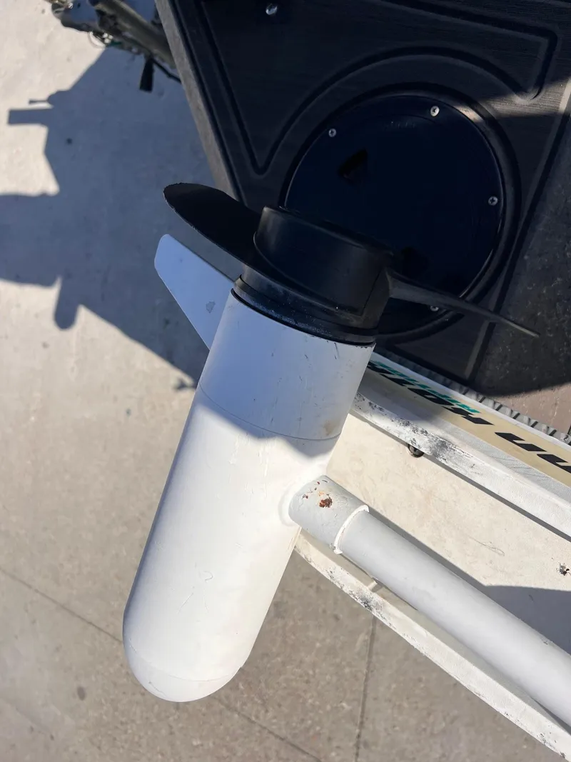 Slide: The Image of Close-up of a 2007 Lakesport 1860 boat motor component on a sunny day. - 12