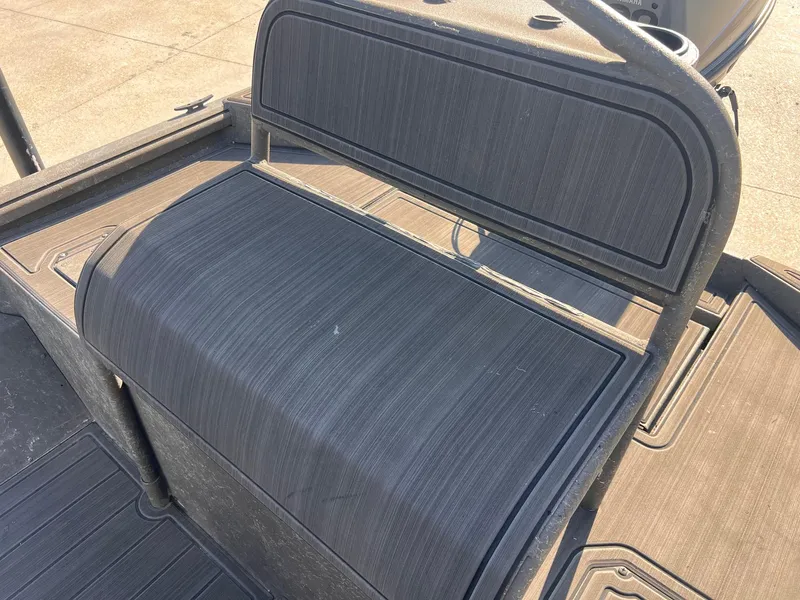 Slide: The Image of 2007 Lakesport 1860 boat seat with textured design, outdoor setting. - 7