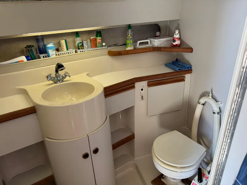 Slide: The Image of Bathroom interior of 1990 Carver 30 Santego boat with sink and toilet. - 12