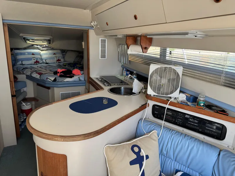 Slide: The Image of Interior of a 1990 Carver 30 Santego boat with cozy cabin and kitchenette. - 6