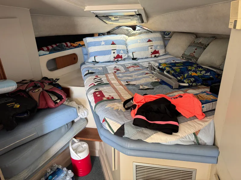 Slide: The Image of Cozy cabin interior of 1990 Carver 30 Santego with colorful bedding and personal items. - 8