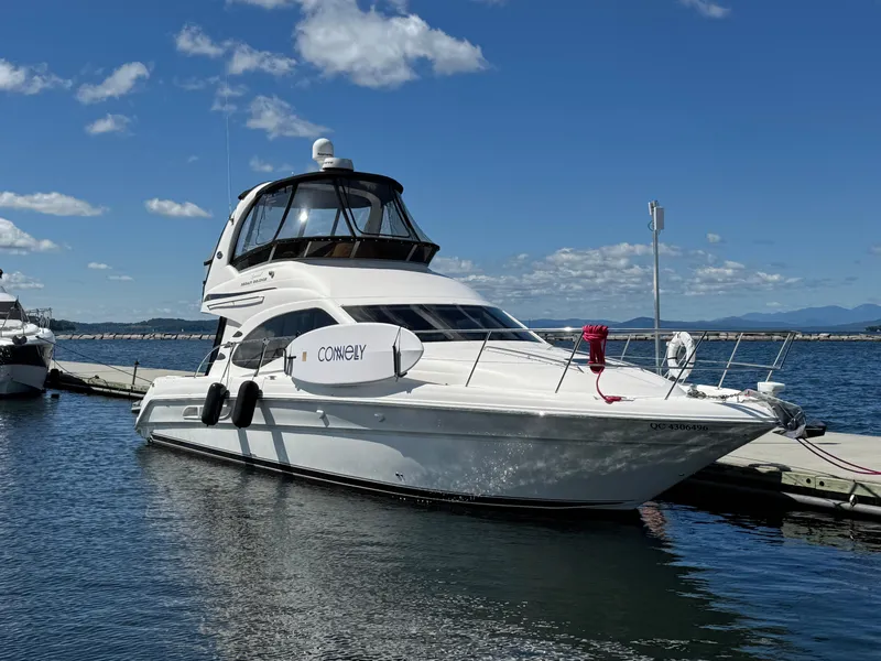 The Image of 2005 Sea Ray 420 Sedan Bridge yacht docked on a sunny day. - 0