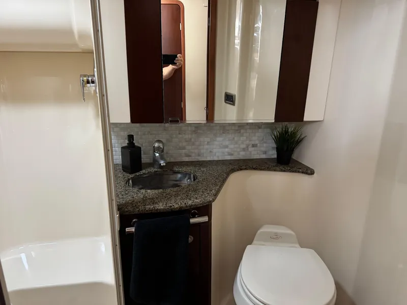 Slide: The Image of Luxurious bathroom in 2005 Sea Ray 420 Sedan Bridge yacht with granite countertop. - 15