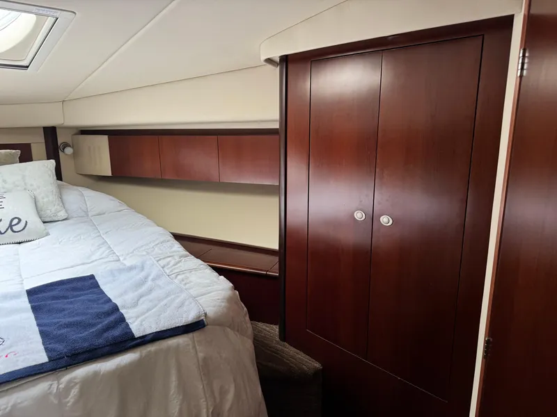 Slide: The Image of Luxurious cabin interior of 2005 Sea Ray 420 Sedan Bridge yacht with wood cabinetry. - 18