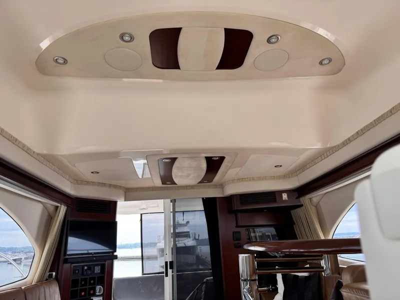 Slide: The Image of Interior of 2005 Sea Ray 420 Sedan Bridge yacht with modern design and panoramic windows. - 24
