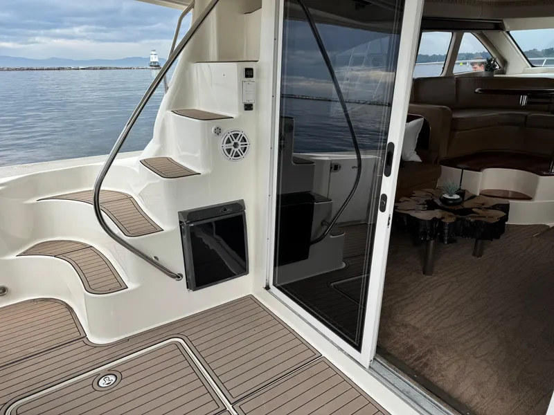 Slide: The Image of 2005 Sea Ray 420 Sedan Bridge yacht interior with elegant seating and modern design. - 26