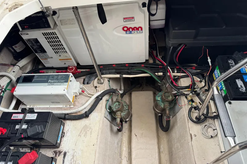 Slide: The Image of Engine room of 2005 Sea Ray 420 Sedan Bridge with Onan generator and ProMariner charger. - 32