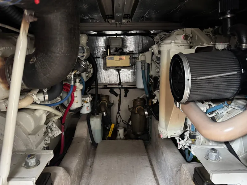 Slide: The Image of Engine room of 2005 Sea Ray 420 Sedan Bridge, showcasing mechanical components and systems. - 34
