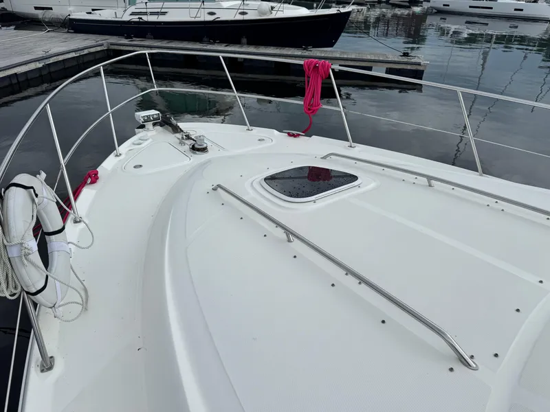 Slide: The Image of 2005 Sea Ray 420 Sedan Bridge yacht deck with life ring and red rope. - 36