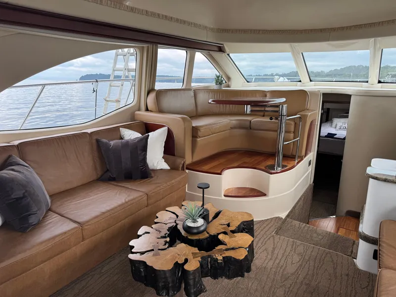 Slide: The Image of Luxurious interior of a 2005 Sea Ray 420 Sedan Bridge yacht with elegant seating and decor. - 4