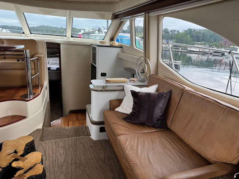 Slide: The Image of Luxurious interior of 2005 Sea Ray 420 Sedan Bridge yacht with comfortable seating and scenic views. - 8