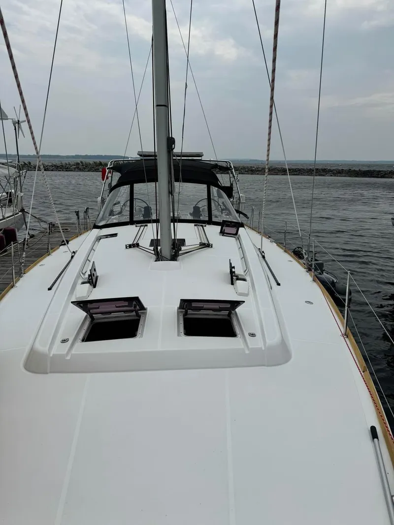 Slide: The Image of 2013 Beneteau Oceanis 48 sailboat deck view at marina. - 2