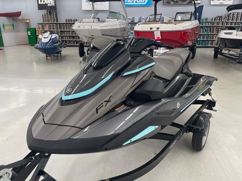 Slide: The Image of 2025 Yamaha WaveRunner FX Cruiser HO in showroom, sleek design with blue accents. - 7