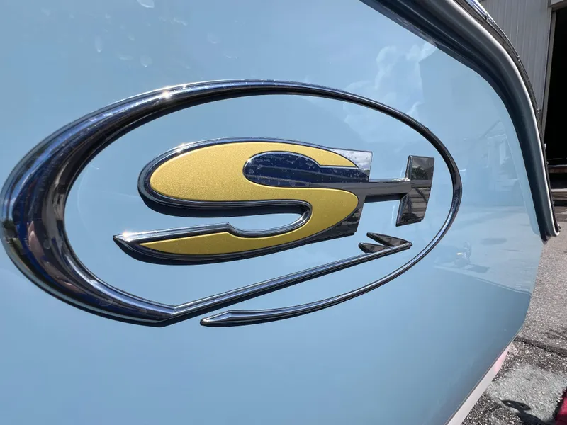 Slide: The Image of 2024 Sea Hunt Ultra 239 SE logo on light blue boat exterior. - 22