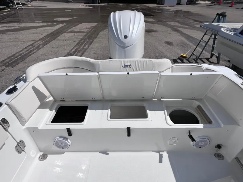 Slide: The Image of 2024 Sea Hunt Ultra 239 SE boat interior with open storage compartments. - 31