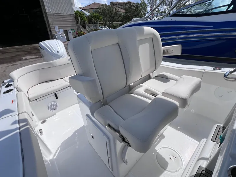 Slide: The Image of 2024 Sea Hunt Ultra 239 SE boat interior with plush seating and modern design. - 39