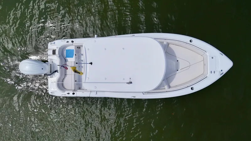 Slide: The Image of Top view of 2024 Sea Hunt Ultra 239 SE boat on water. - 5