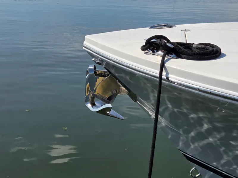 Slide: The Image of 2021 Regulator 31 CC boat bow with anchor and rope on calm water. - 6