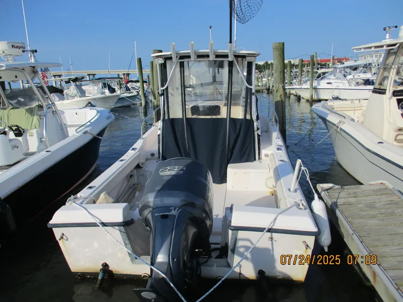 Slide: The Image of 1998 Grady-White 226 Seafarer WA boat docked at marina, rear view. - 0