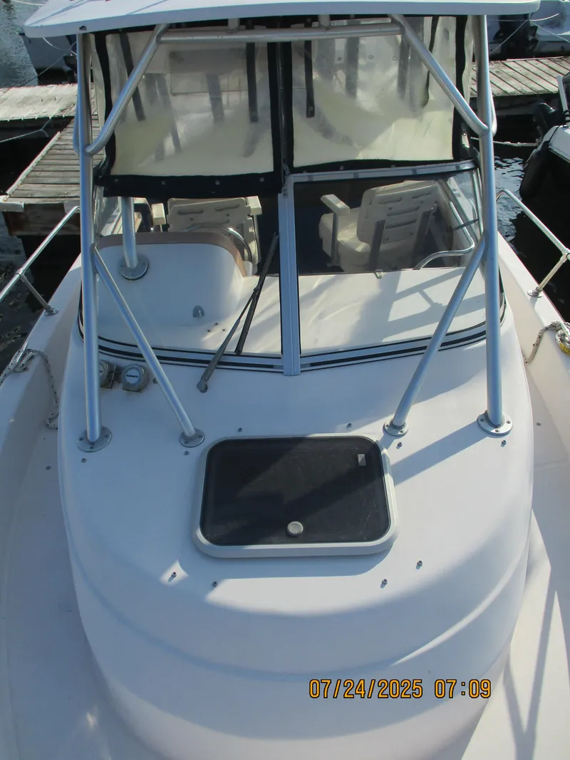 Slide: The Image of 1998 Grady-White 226 Seafarer WA boat docked, viewed from the bow. - 10