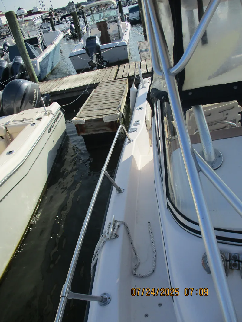 Slide: The Image of 1998 Grady-White 226 Seafarer WA docked at marina, side view. - 12