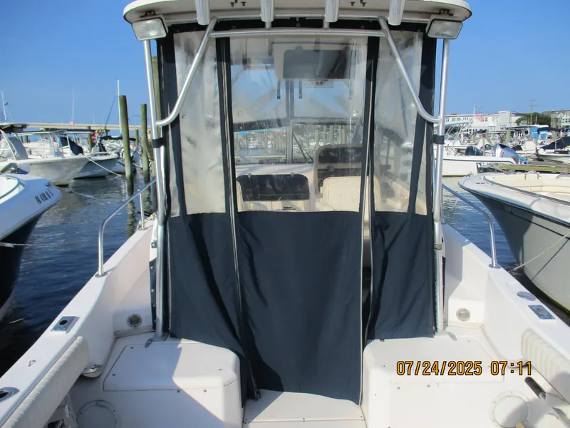 Slide: The Image of 1998 Grady-White 226 Seafarer WA boat docked at marina, rear view. - 4