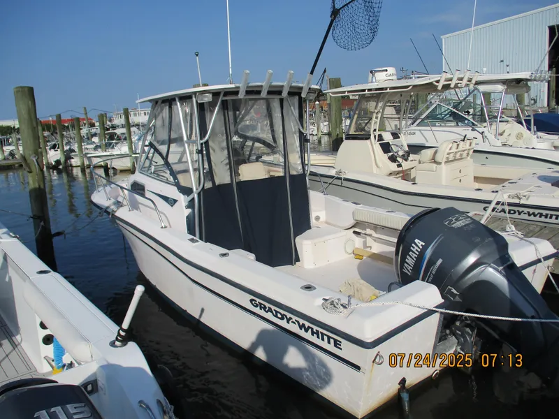 Slide: The Image of 1998 Grady-White 226 Seafarer WA boat docked with Yamaha outboard motor. - 8