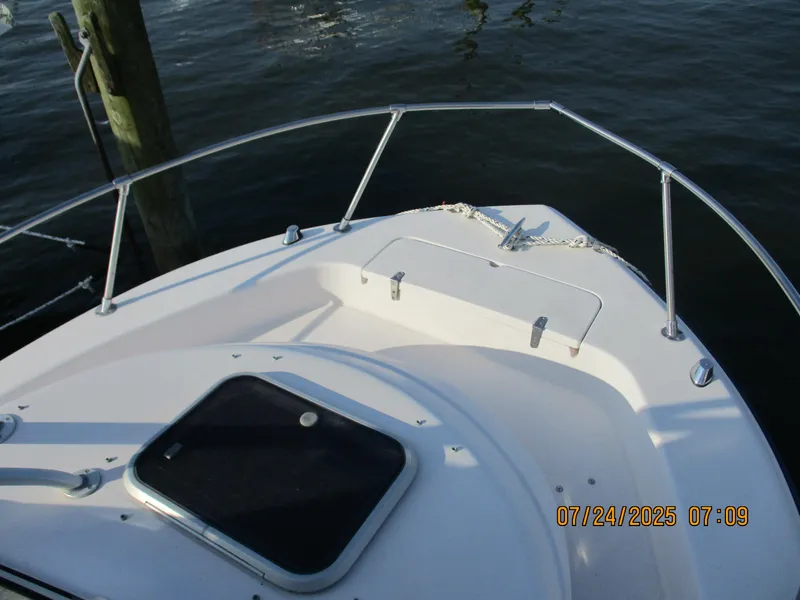 Slide: The Image of 1998 Grady-White 226 Seafarer WA boat deck with railing and hatch. - 9