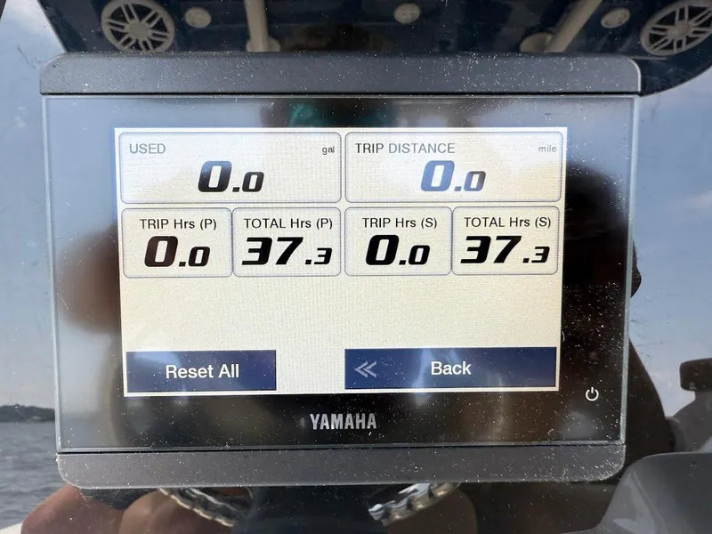 Slide: The Image of Yamaha display showing trip data on 2023 NauticStar 28 XS boat. - 21