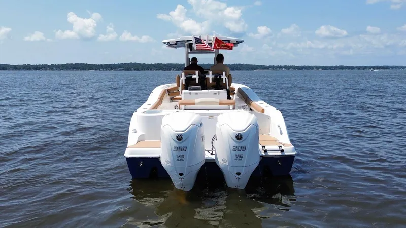 Slide: The Image of 2023 NauticStar 28 XS boat with dual engines on open water. - 3
