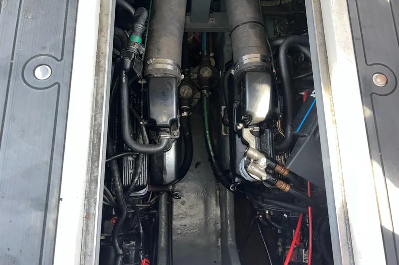 Slide: The Image of Engine compartment of a 1991 Sea Ray 310 Sundancer boat, showing detailed components. - 23