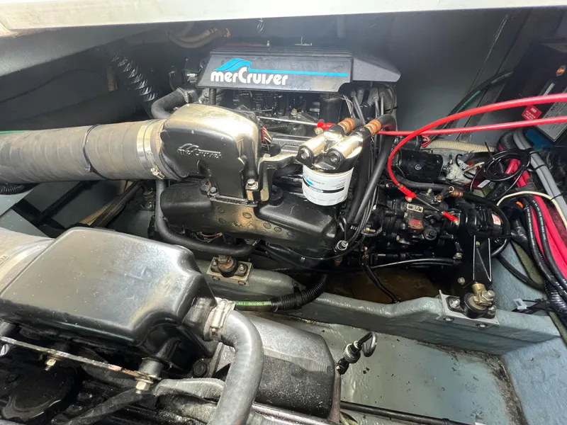 Slide: The Image of Engine compartment of a 1991 Sea Ray 310 Sundancer with MerCruiser components. - 24
