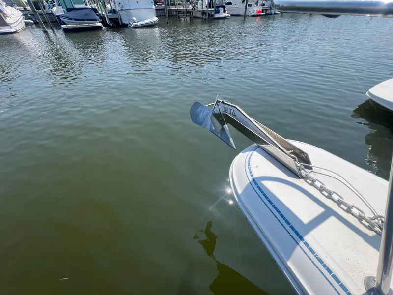 Slide: The Image of Bow of 1991 Sea Ray 310 Sundancer with anchor, docked in marina. - 8