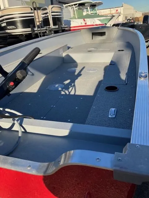 Slide: The Image of 2025 Lund 1600 Fury Tiller boat interior, featuring spacious deck and modern controls. - 6