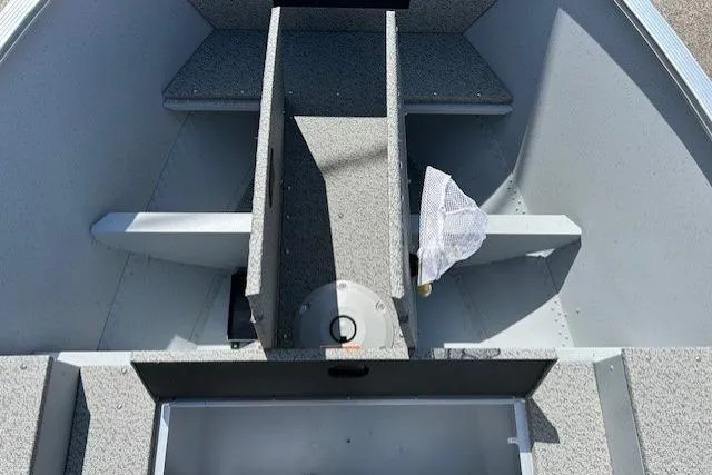 Slide: The Image of 2026 Lund 1600 Fury SS boat interior with storage compartments and seating. - 11