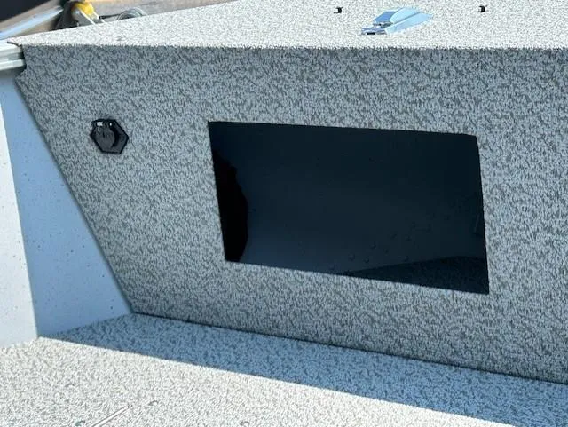 Slide: The Image of 2026 Lund 1600 Fury SS boat interior with storage compartment and textured finish. - 12