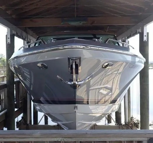 Slide: The Image of 2020 Formula 430 Super Sport Crossover boat docked under shelter. - 16