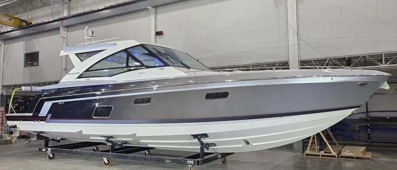 Slide: The Image of 2020 Formula 430 Super Sport Crossover boat in a showroom, side view. - 2