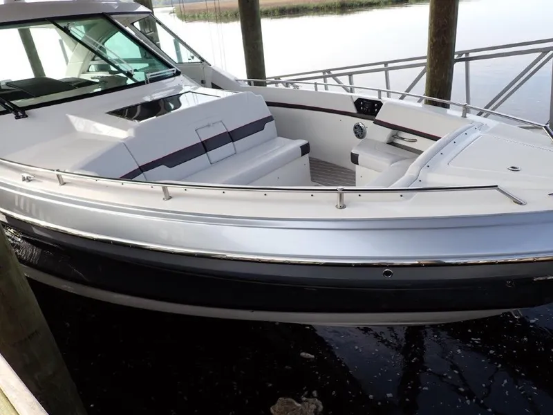 Slide: The Image of 2020 Formula 430 Super Sport Crossover boat docked, featuring sleek design and spacious seating. - 20