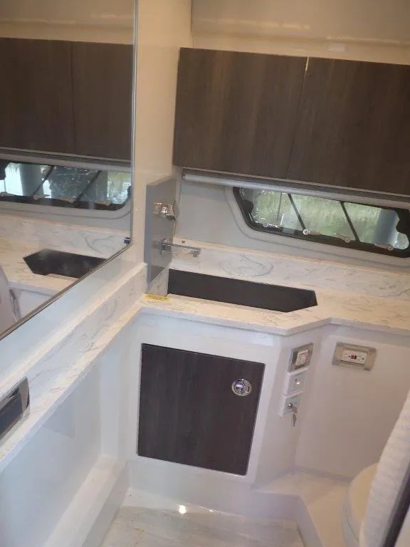 Slide: The Image of Interior of 2020 Formula 430 Super Sport Crossover, featuring modern cabinetry and sleek design. - 23