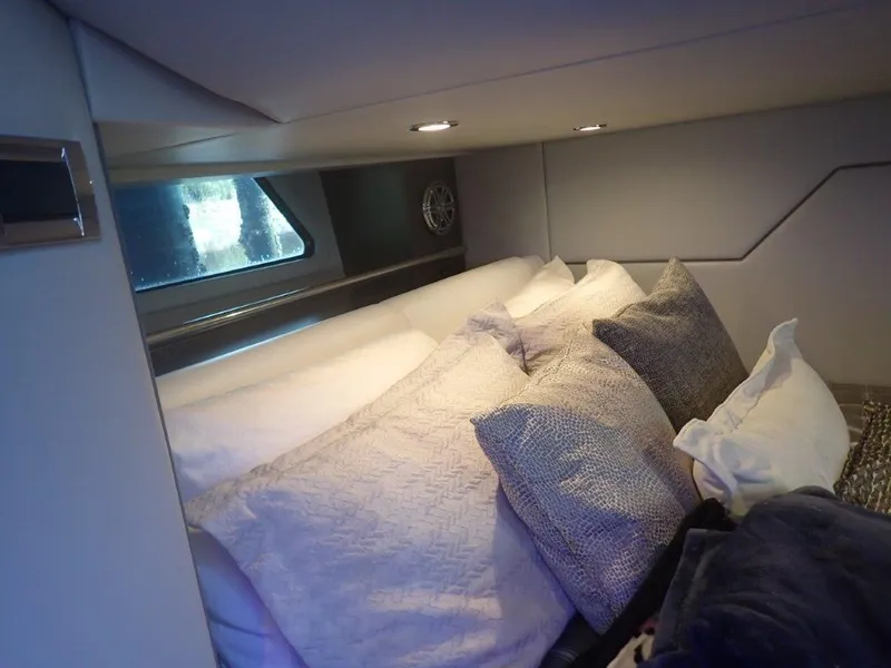 Slide: The Image of Cozy cabin interior of 2020 Formula 430 Super Sport Crossover with plush pillows and soft lighting. - 25