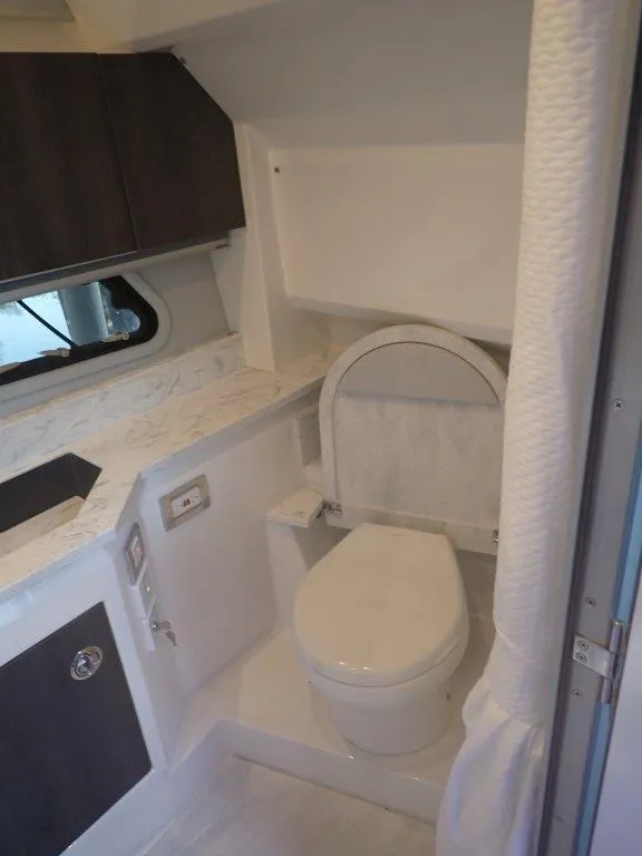 Slide: The Image of 2020 Formula 430 Super Sport Crossover bathroom with modern fixtures and marble countertop. - 3