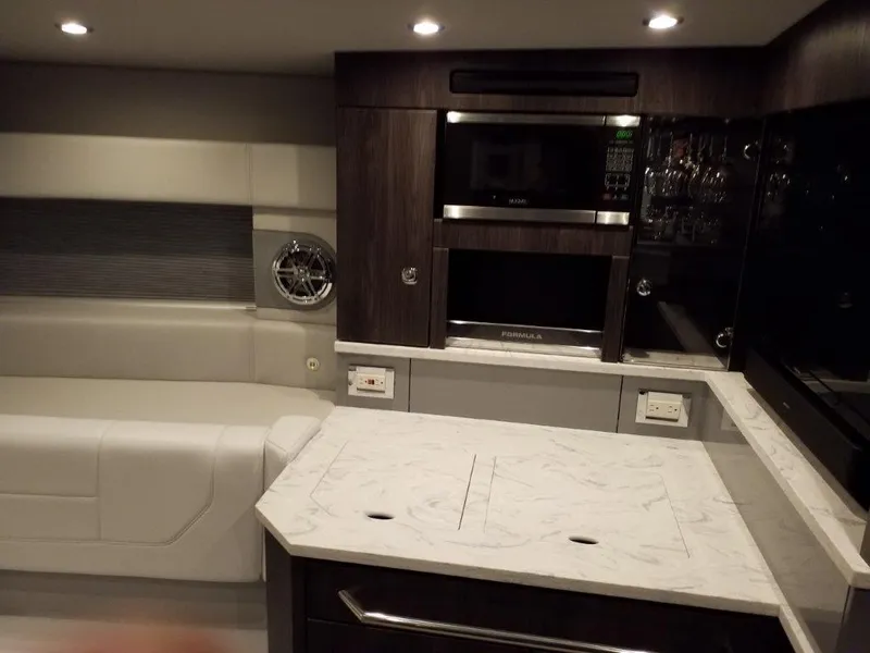 Slide: The Image of Luxurious interior of 2020 Formula 430 Super Sport Crossover with modern kitchen amenities. - 36