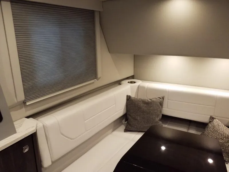 Slide: The Image of 2020 Formula 430 Super Sport Crossover interior with white seating and cushions. - 37