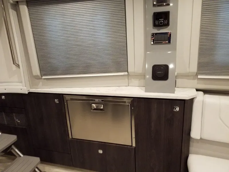 Slide: The Image of Interior of 2020 Formula 430 Super Sport Crossover with modern cabinetry and control panel. - 39