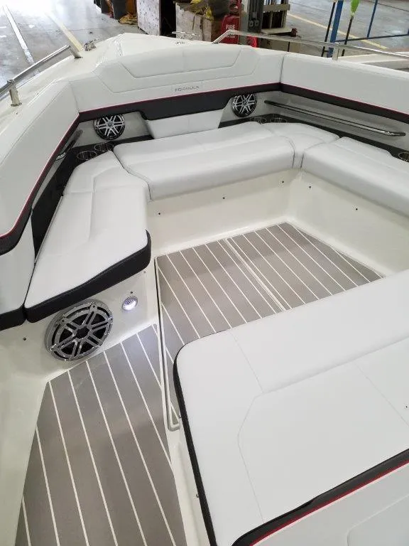 Slide: The Image of 2020 Formula 430 Super Sport Crossover boat interior with white seating and striped flooring. - 7