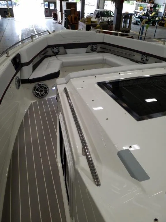 Slide: The Image of 2020 Formula 430 Super Sport Crossover boat interior with seating and speakers. - 8