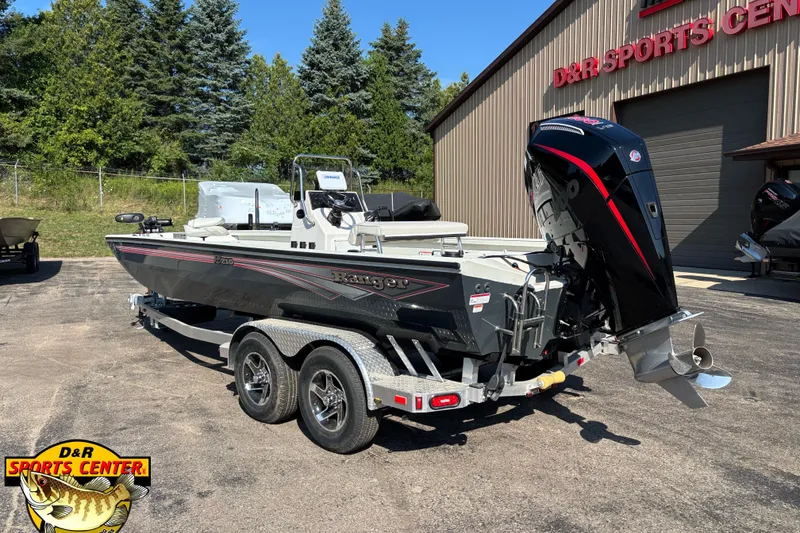 Slide: The Image of 2025 Ranger RB210 boat at D&R Sports Center, featuring a sleek design and powerful engine. - 2