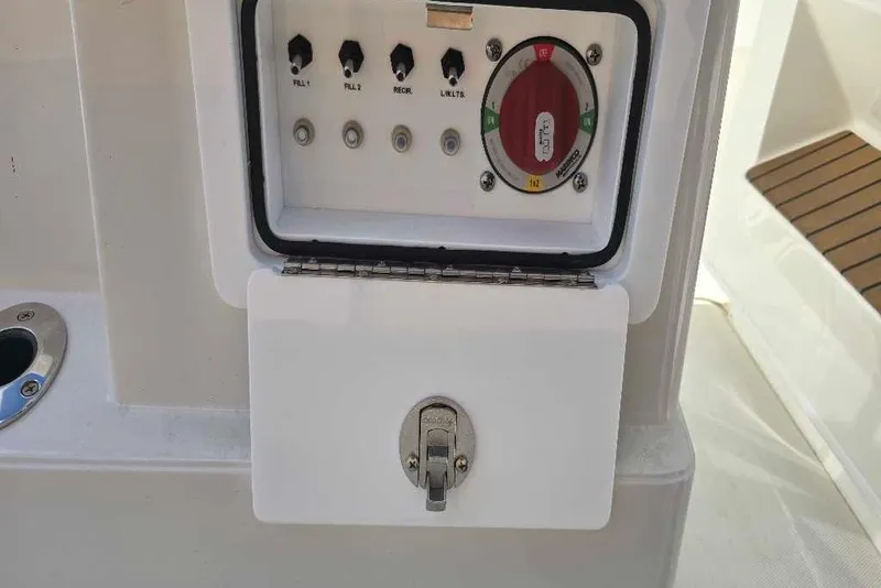 Slide: The Image of Control panel on 2025 Ranger 2360 Bay boat with switches and dial. - 13