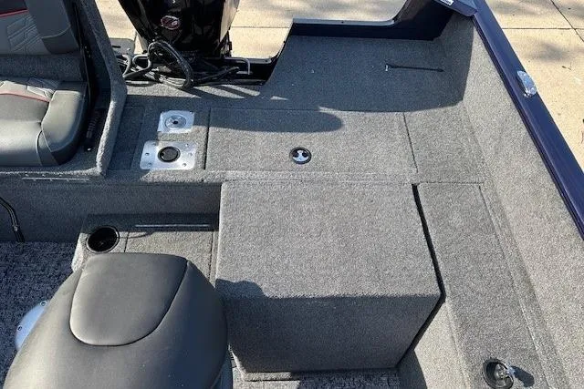 Slide: The Image of 2025 Tracker Pro Guide V-175 Combo boat interior with seating and storage compartments. - 10